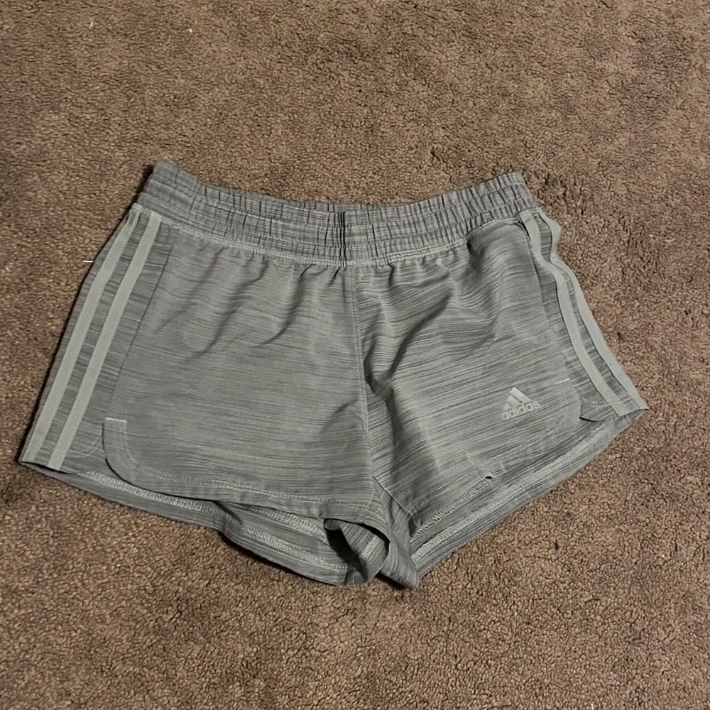 gray adidas workout shorts with signature stripes